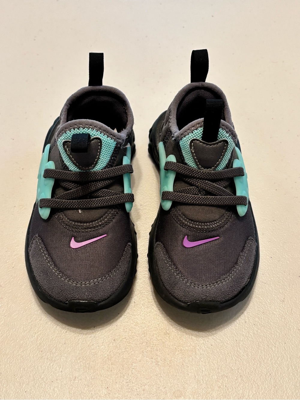 Nike Kids Black Sneakers with Teal Accents and Pink Swoosh 9